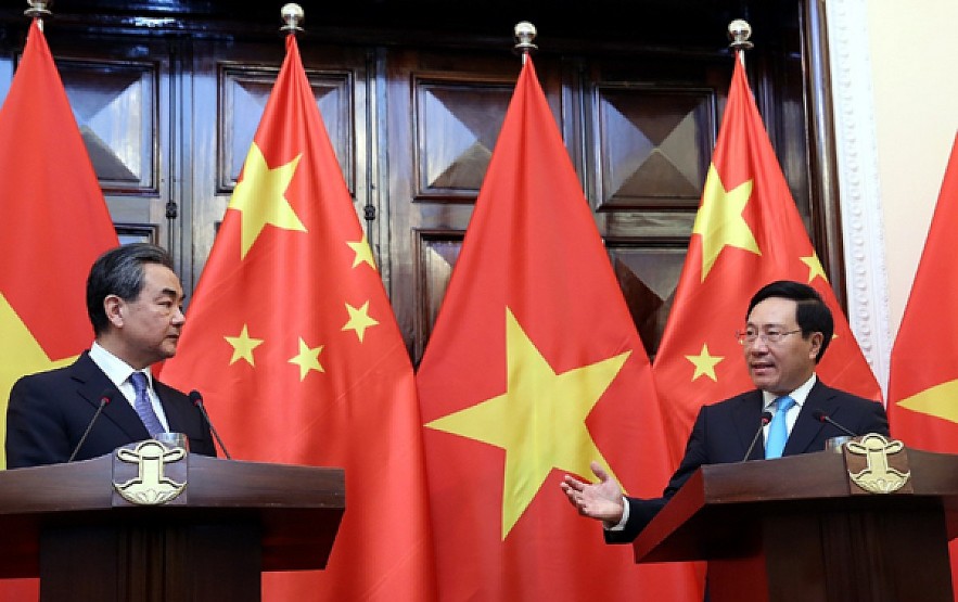 Deputy Prime Minister Pham Minh Minh (R) welcomes Chinese State Councilor cum Foreign Minister Wang Yi in Hanoi in 2018. The two officials are scheduled to co-chair the 14th meeting of the steering committee for bilateral cooperation in Naning during Minh's visit on July 12-13. Illustrative photo: VGP Deputy Prime Minister Pham Minh Minh (R) welcomes Chinese State Councilor cum Foreign Minister Wang Yi in Hanoi in 2018. The two officials are scheduled to co-chair the 14th meeting of the steering committee for bilateral cooperation in Naning during Minh's visit on July 12-13. Illustrative photo: VGP