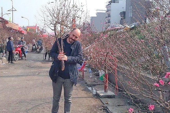Daniel celebrates Vietnamese New Year with a branch of Nhat Tan peach. Daniel celebrates Vietnamese New Year with a branch of Nhat Tan peach.