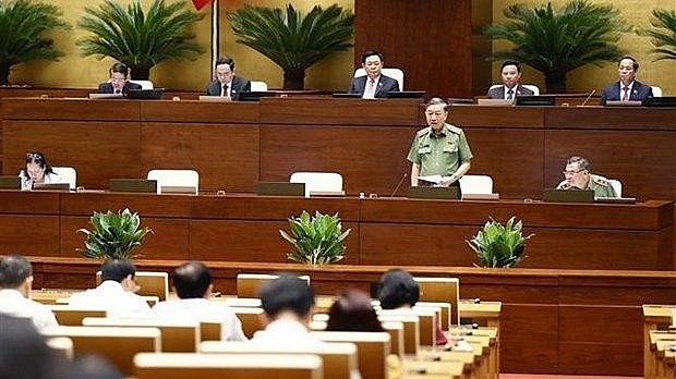 Minister of Public Security Gen. To Lam answers questions from lawmakers on August 10. Photo: VNA Minister of Public Security Gen. To Lam answers questions from lawmakers on August 10. Photo: VNA
