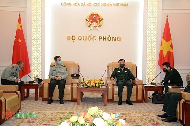 Vietnam enhances defence ties with China: Deputy Minister of National Defence Sen. Lt. Gen. Hoang Xuan Chien (R) welcomes Chinese Defence Attaché to Vietnam Pan Tao. Photo: qdnd.vn Vietnam enhances defence ties with China: Deputy Minister of National Defence Sen. Lt. Gen. Hoang Xuan Chien (R) welcomes Chinese Defence Attaché to Vietnam Pan Tao. Photo: qdnd.vn