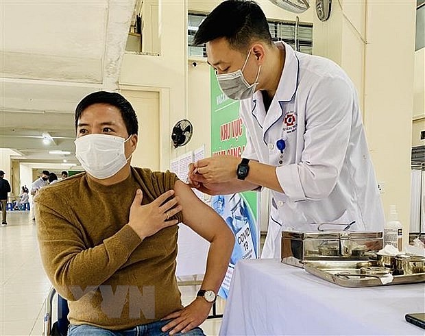 A man gets vaccinated against Covid-19. Photo: VNA A man gets vaccinated against Covid-19. Photo: VNA