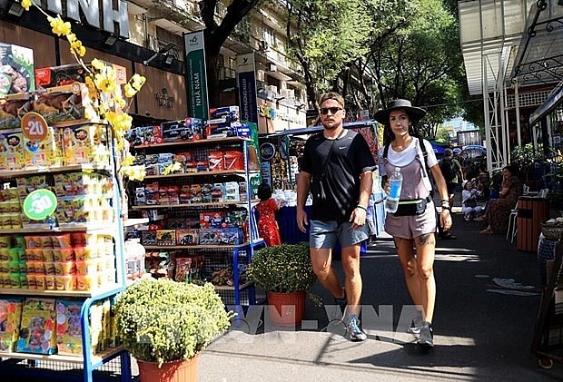 Foreign tourists visit book street in Ho Chi Minh City on the occasion of Tet (Lunar New Year) holiday. (Photo: VNA) Foreign tourists visit book street in Ho Chi Minh City on the occasion of Tet (Lunar New Year) holiday. (Photo: VNA)