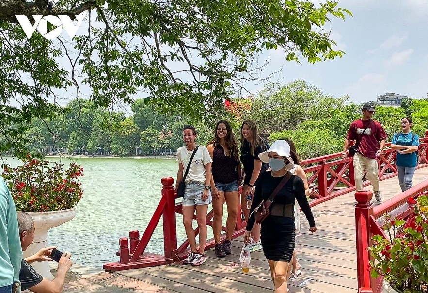 Foreign tourists visit Hoan Kiem Lake in Hanoi. Foreign tourists visit Hoan Kiem Lake in Hanoi.