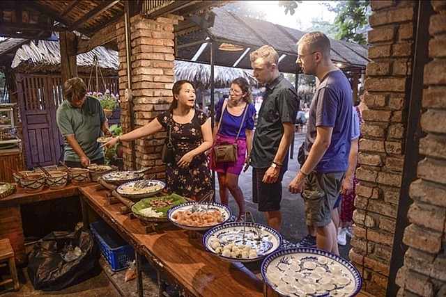 A group of foreign tourists visit Bình Quới tourism village in Bình Thạnh District. Photo tuoitre.vn A group of foreign tourists visit Bình Quới tourism village in Bình Thạnh District. Photo tuoitre.vn