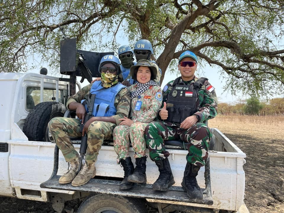 Vietnamese Female Peacekeeper Treasures the National Flag Vietnamese Peacekeeper Treasures the National Flag