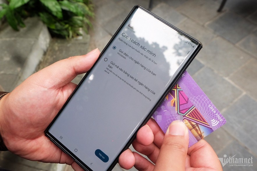 A user integrates a payment card into a digital wallet on a mobile application. Photo: Trong Dat A user integrates a payment card into a digital wallet on a mobile application. Photo: Trong Dat