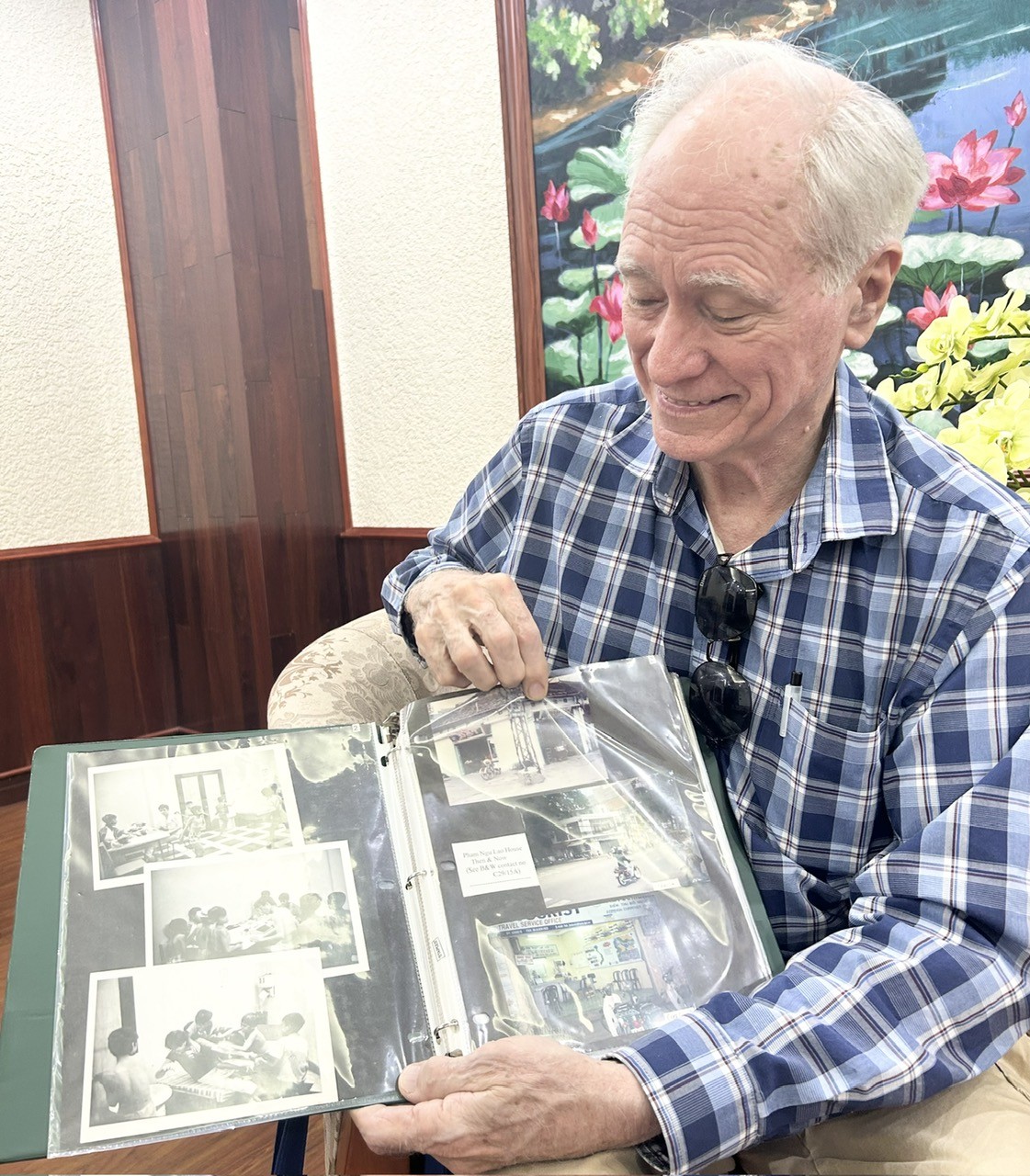 Dick Hughes always carries an album of photos of the street children he once cared for whenever he returns to Vietnam. Dick Hughes always carries an album of photos of the street children he once cared for whenever he returns to Vietnam.