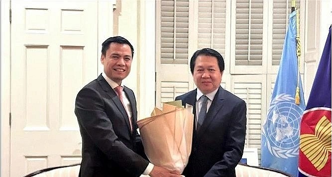 Ambassador Dang Hoang Giang, Permanent Representative of Vietnam to the United Nations (UN) congratulates his Lao counterpart. Ambassador Dang Hoang Giang, Permanent Representative of Vietnam to the United Nations (UN) congratulates his Lao counterpart.