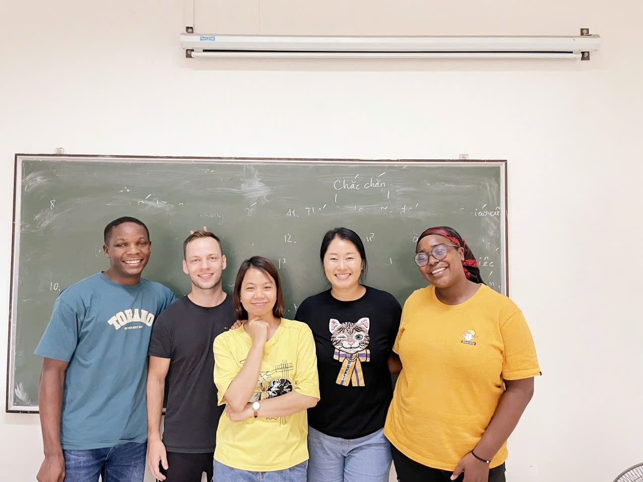 Phong Lan (third from left) with foreign students. Phong Lan (third from left) with foreign students.