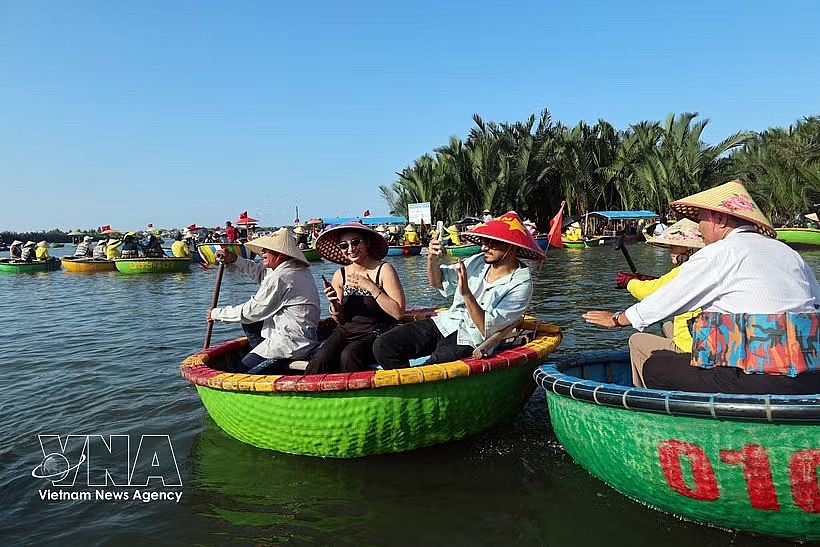 International visitors enjoy riding traditional basket boats through the coconut palm waterways of Cam Thanh village, named among the world's 50 most beautiful villages in 2025. (Photo: VNA) International visitors enjoy riding traditional basket boats through the coconut palm waterways of Cam Thanh village, named among the world's 50 most beautiful villages in 2025. (Photo: VNA)