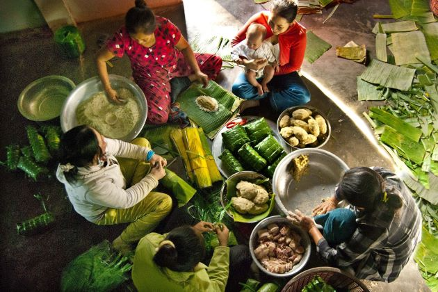 Lunar New Year: History, significance and celebrations 5914 a family making chung cake for tet holiday