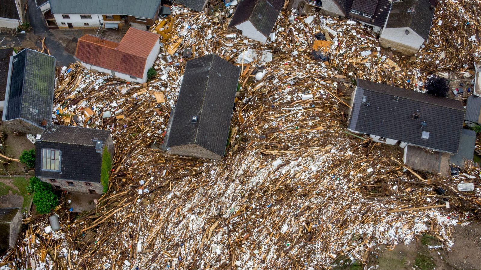 Trees and other detritus were left between houses in Schuld, Germany. Pic: Associated Press Trees and other detritus were left between houses in Schuld, Germany. Pic: Associated Press