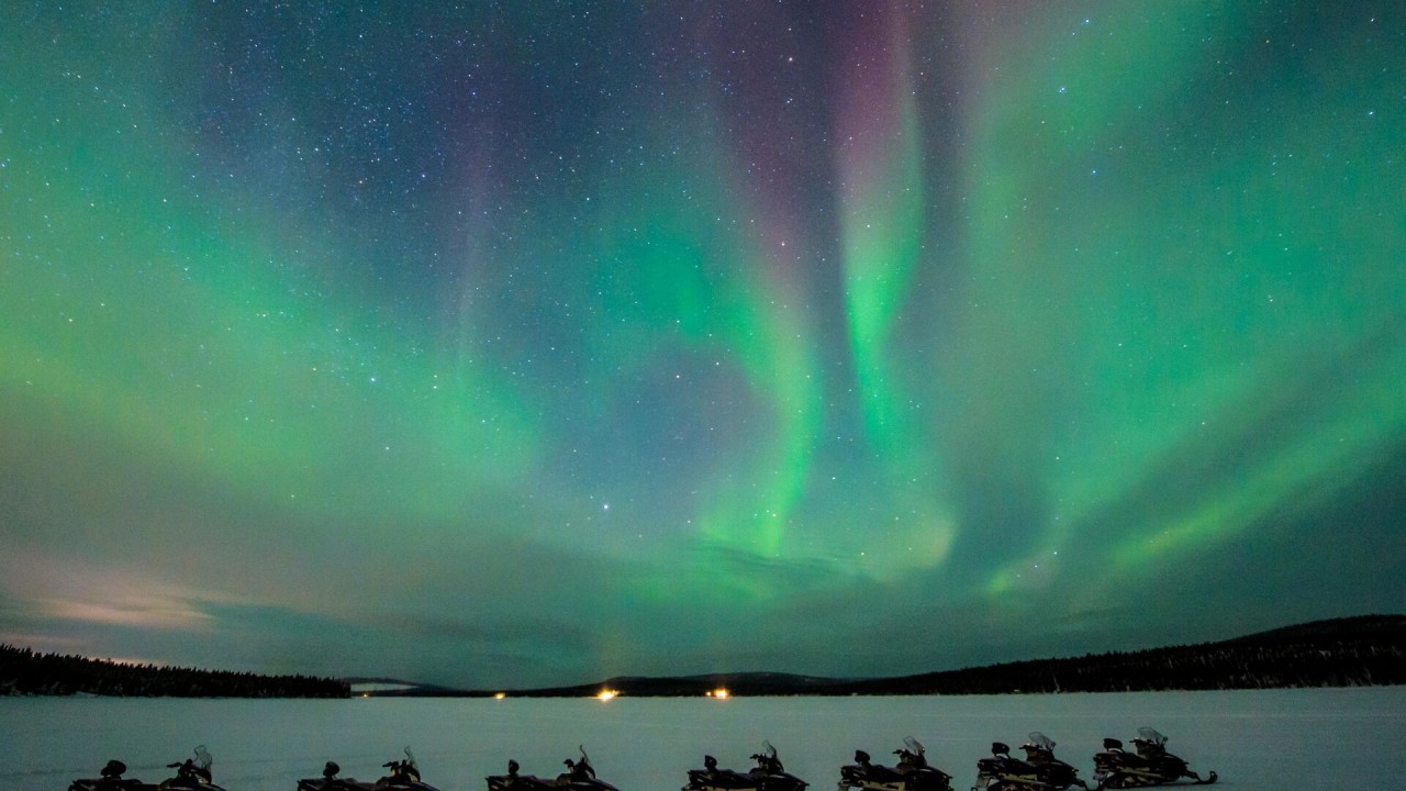 Northern lights on a snowmobile excursion ©Asaf Kliger - ICEHOTEL Northern lights on a snowmobile excursion ©Asaf Kliger - ICEHOTEL