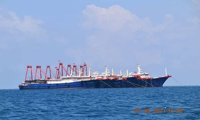 A Chinese military vessel is seen near the Whitsun Reef, March 7, 2021. Photo by Reuters. A Chinese military vessel is seen near the Whitsun Reef, March 7, 2021. Photo by Reuters.