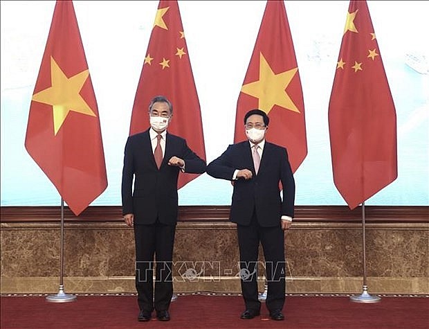 Politburo member and Standing Deputy Prime Minister Pham Binh Minh (R) and Chinese State Councilor and Foreign Minister Wang Yi (Photo: VNA) Politburo member and Standing Deputy Prime Minister Pham Binh Minh (R) and Chinese State Councilor and Foreign Minister Wang Yi (Photo: VNA)