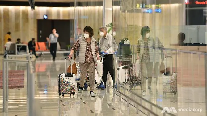 Travellers walking out from the arrival hall at Changi Airport Terminal 1 (Photo: Jeremy Long) 4612 airport