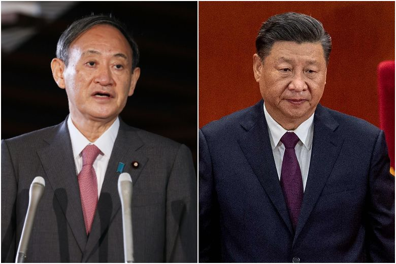 Japanese Prime Minister Yoshihide Suga (left) spoke with Chinese President Xi Jinping on the phone.PHOTOS: AFP 5109 leaders