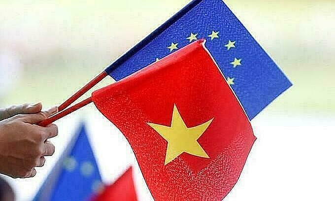 European Union and Vietnamese flags are seen at the signing ceremony of EU-Vietnam Free Trade Agreement at the Government Office in Hanoi, June 30, 2019. Photo by Reuters/Kham. European Union and Vietnamese flags are seen at the signing ceremony of EU-Vietnam Free Trade Agreement at the Government Office in Hanoi, June 30, 2019. Photo by Reuters/Kham.