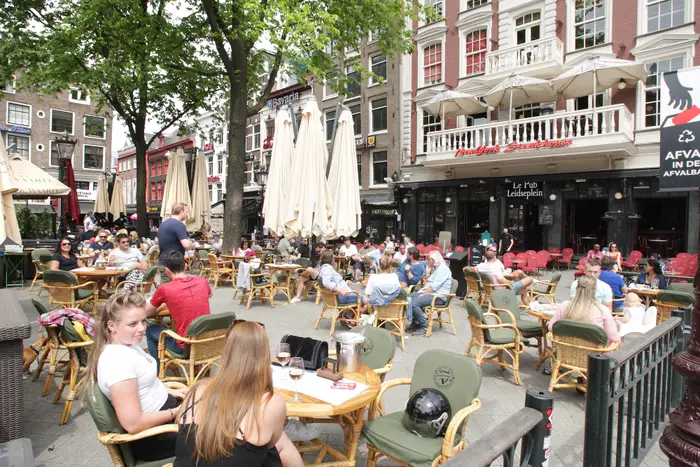 Tourists and locals enjoying on the terrace at the Leidseplen amid the Coronavirus pandemic on June 1, 2020 in Amsterdam, Netherlands. 2929 pop1