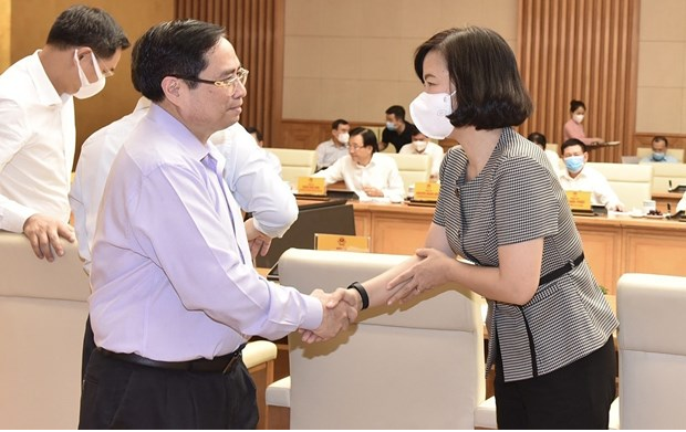 Prime Minister Pham Minh Chinh meets representatives from press agencies on the occasion of the 96th anniversary of Vietnam Revolutionary Press Day (June 21). (Photo: VNA)