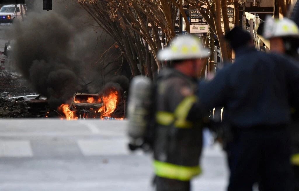 A vehicle burning near the site of the explosion.Credit...Andrew Nelles/Tennessean.com, via Reuters 4128 nav1