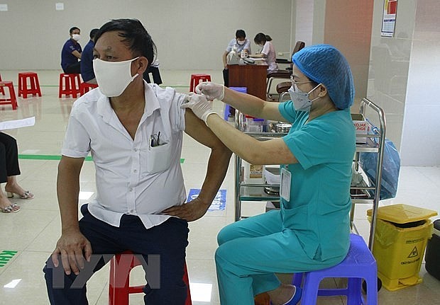 Covid-19 vaccination. Photo: VNA Covid-19 vaccination. Photo: VNA